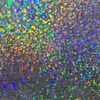 Glitter holographic vinyl with a rainbow spectrum effect and a smooth, light-reflecting dot pattern texture.