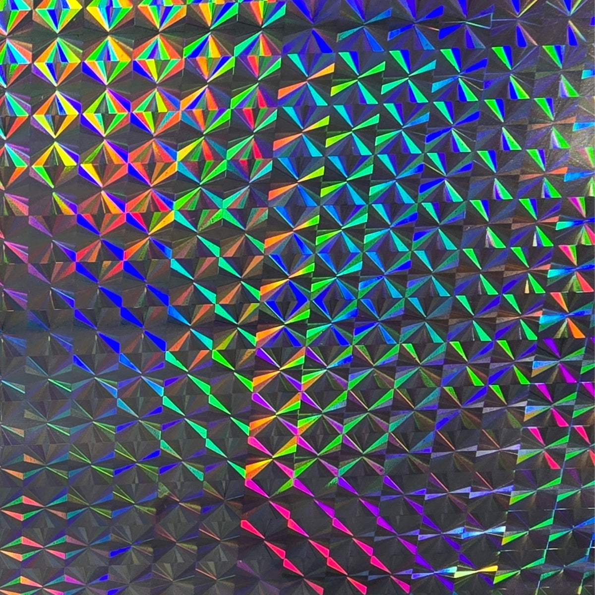 Prismatic holographic vinyl with a geometric diamond pattern reflecting iridescent rainbow colors.